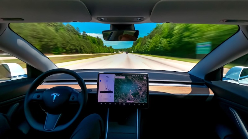 Inside a self-driving car looking out the front window.